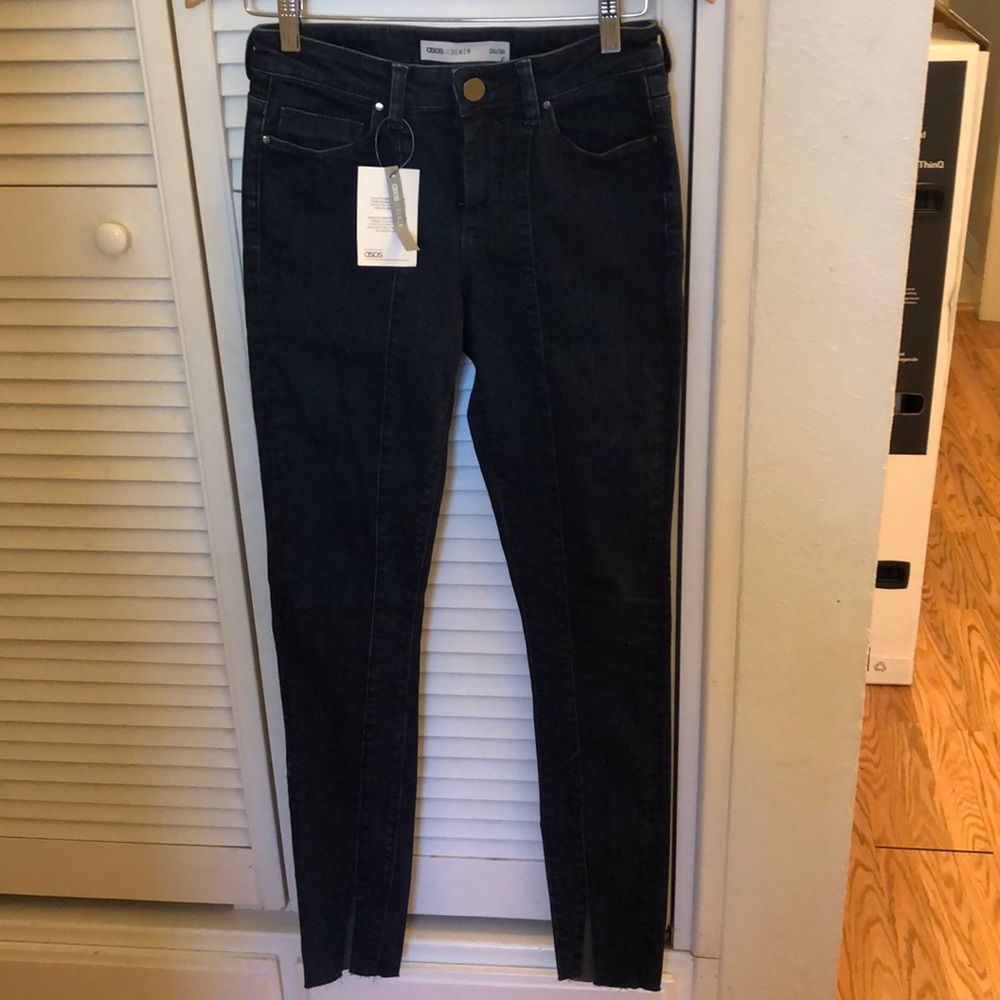 Dark wash skinny jeans by ASOS.